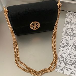 Brand new, authentic! You can wear this classic black bag multi-way!